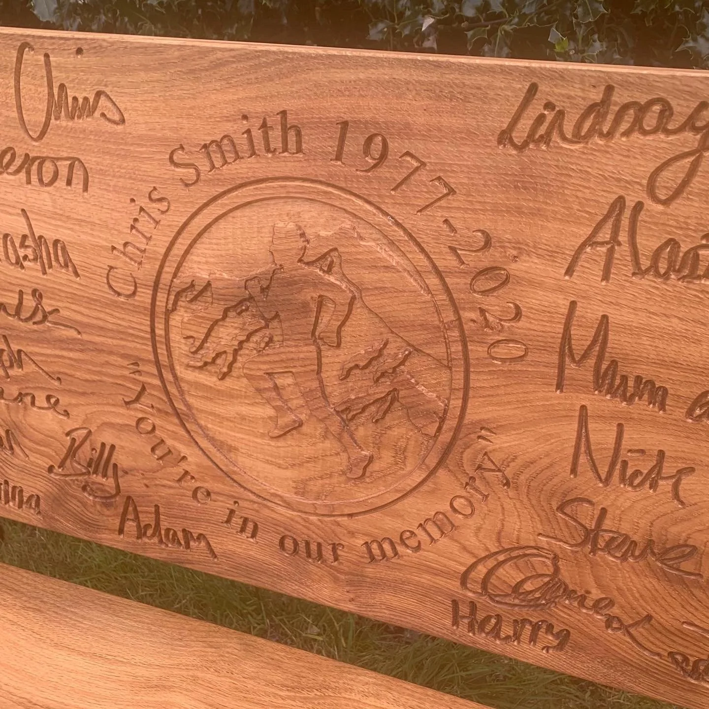 Bespoke Oak Memorial Bench Detail

A close-up of a hand-carved oak memorial bench, featuring personal names, signatures and a central carved tribute. The detail is cut directly into the timber, giving the piece a deeply personal character and a lasti