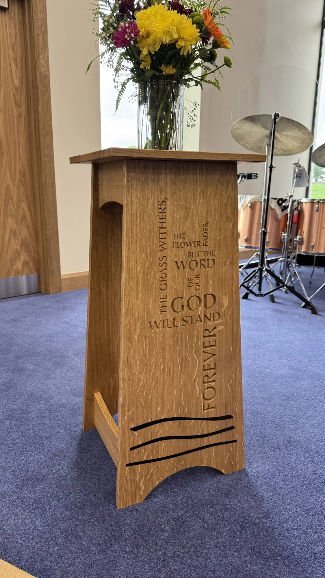 Bespoke Oak Church Flower Stand

A handmade oak flower stand designed for a contemporary church interior, with engraved lettering and dark flowing inlay across the front panel. The natural figure of the oak gives warmth and character, while the inscr