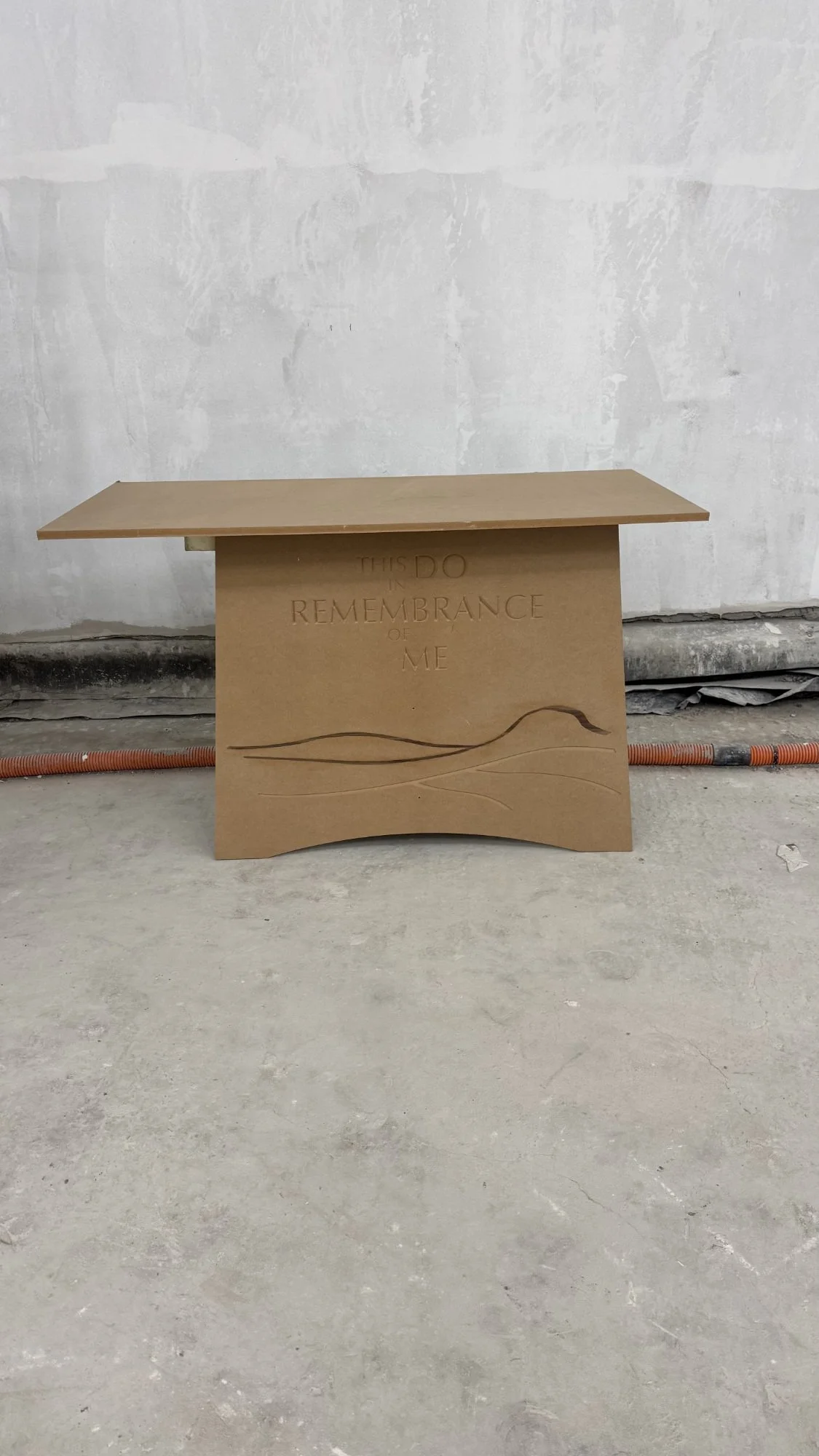 mdf mockup of communion table on site testing of scale