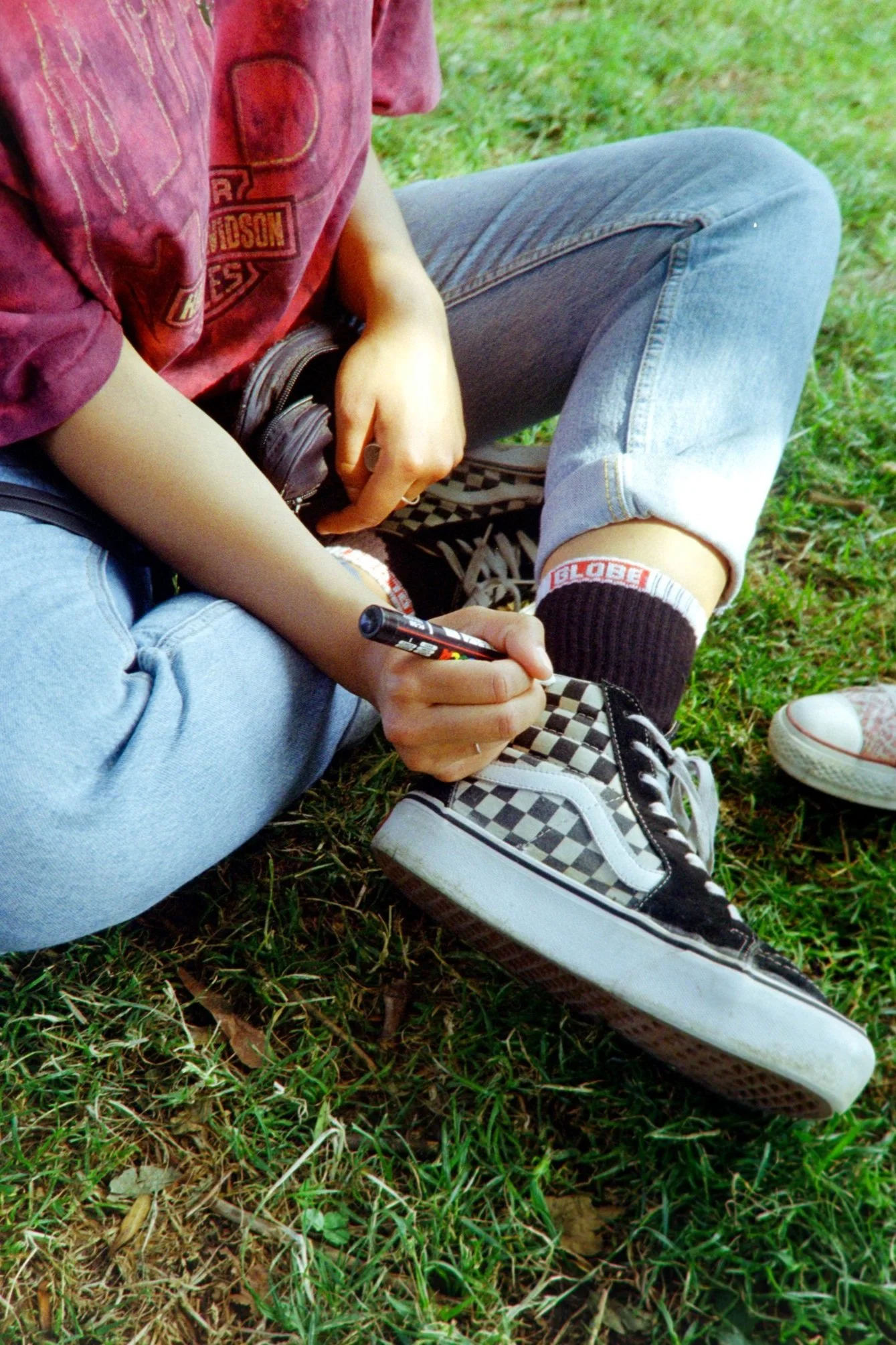 Farai drawing on her shoes (2020)