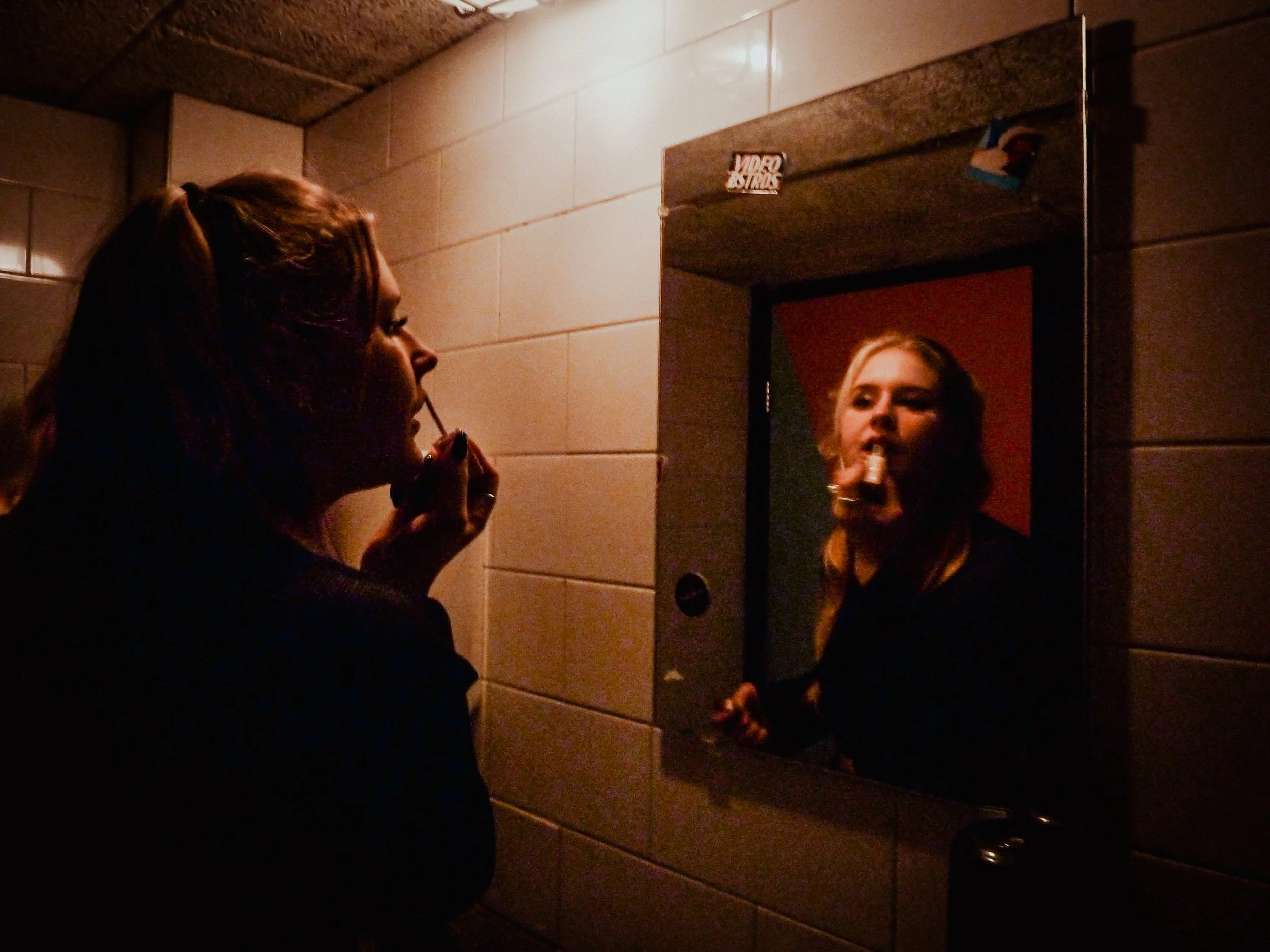 Afra in the club bathroom (2024)