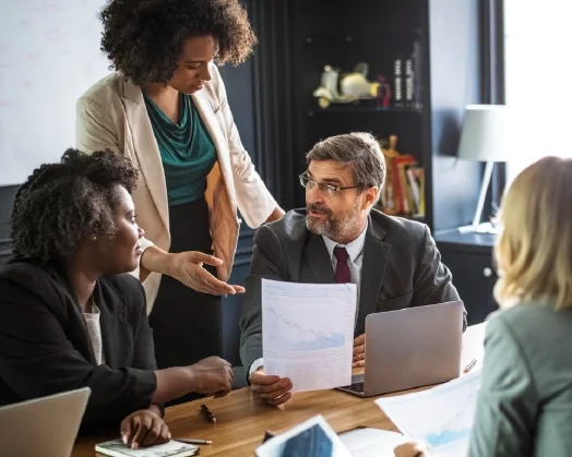 Featuring a collaborative HR consulting discussion where small business leaders review compliance and employee management strategies with an outsourced HR team in Ohio.