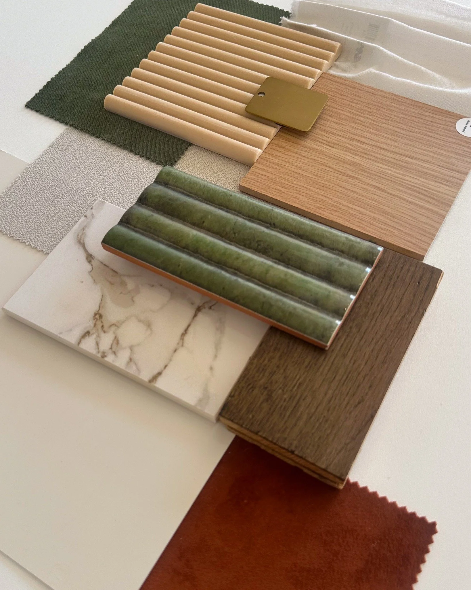 Here&rsquo;s a little peek at the materials that shaped our upcoming project. 🤍 Warm neutrals for calm, grounding greens for nature, textures for comfort, and a pop of rust for a bit of vibrance, a palette that captures the heart of the brand @fika.