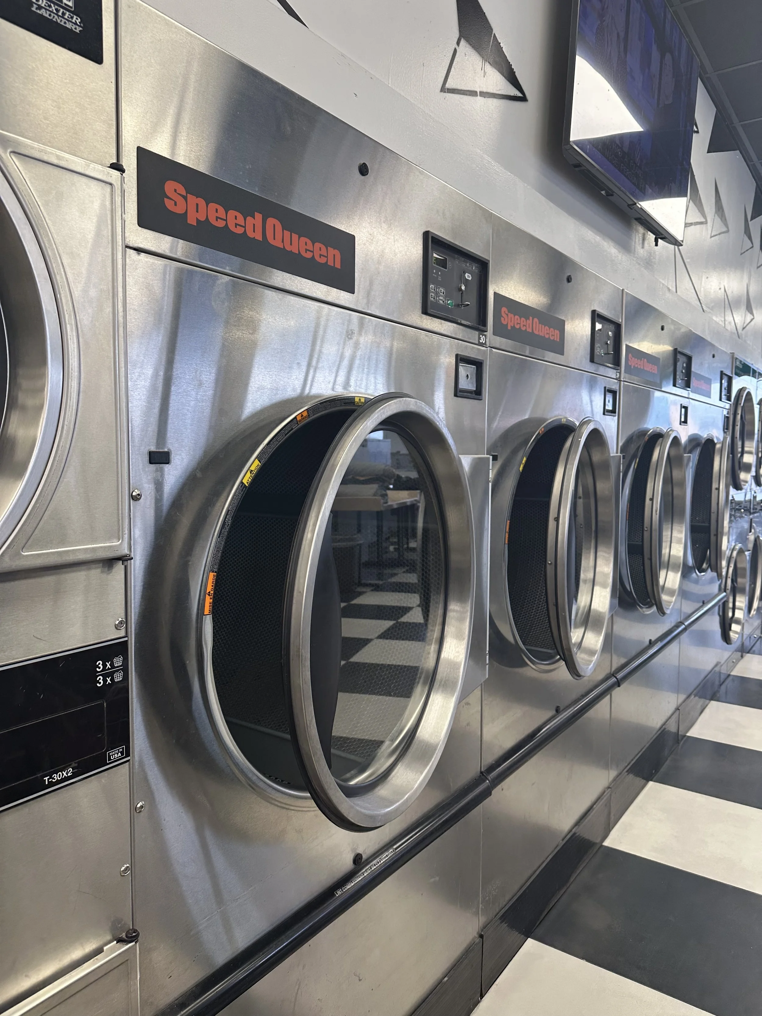 Modern commercial dryer at Eastside Coin Laundry with free drying available with every wash in Kansas City, Missouri.