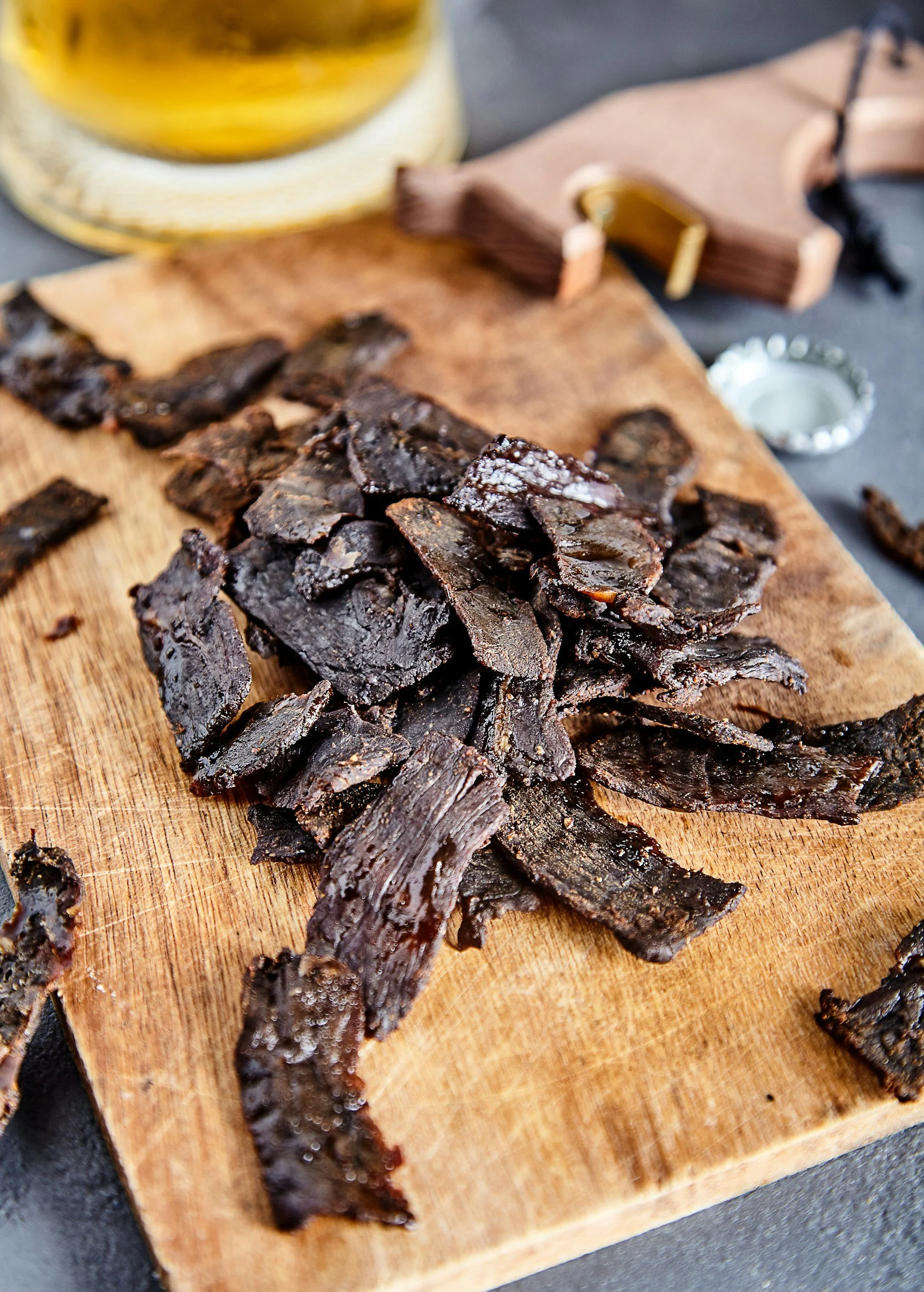 Jerky sitting on a wooden board