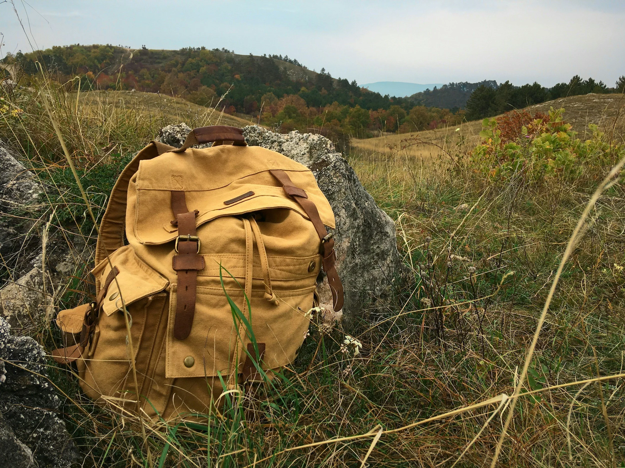 A backpack on the ground out in the wilderness