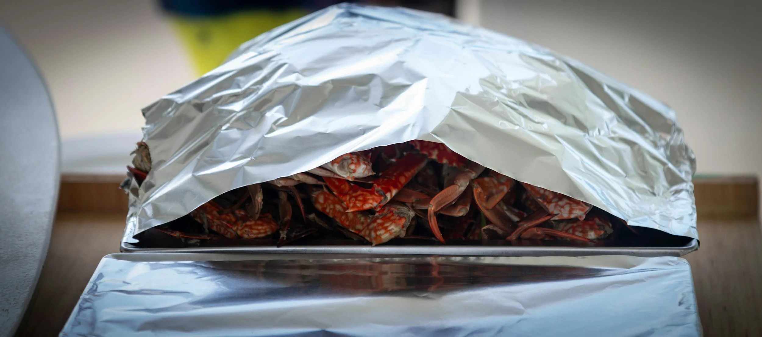 Seafood on a tray covered with aluminum foil
