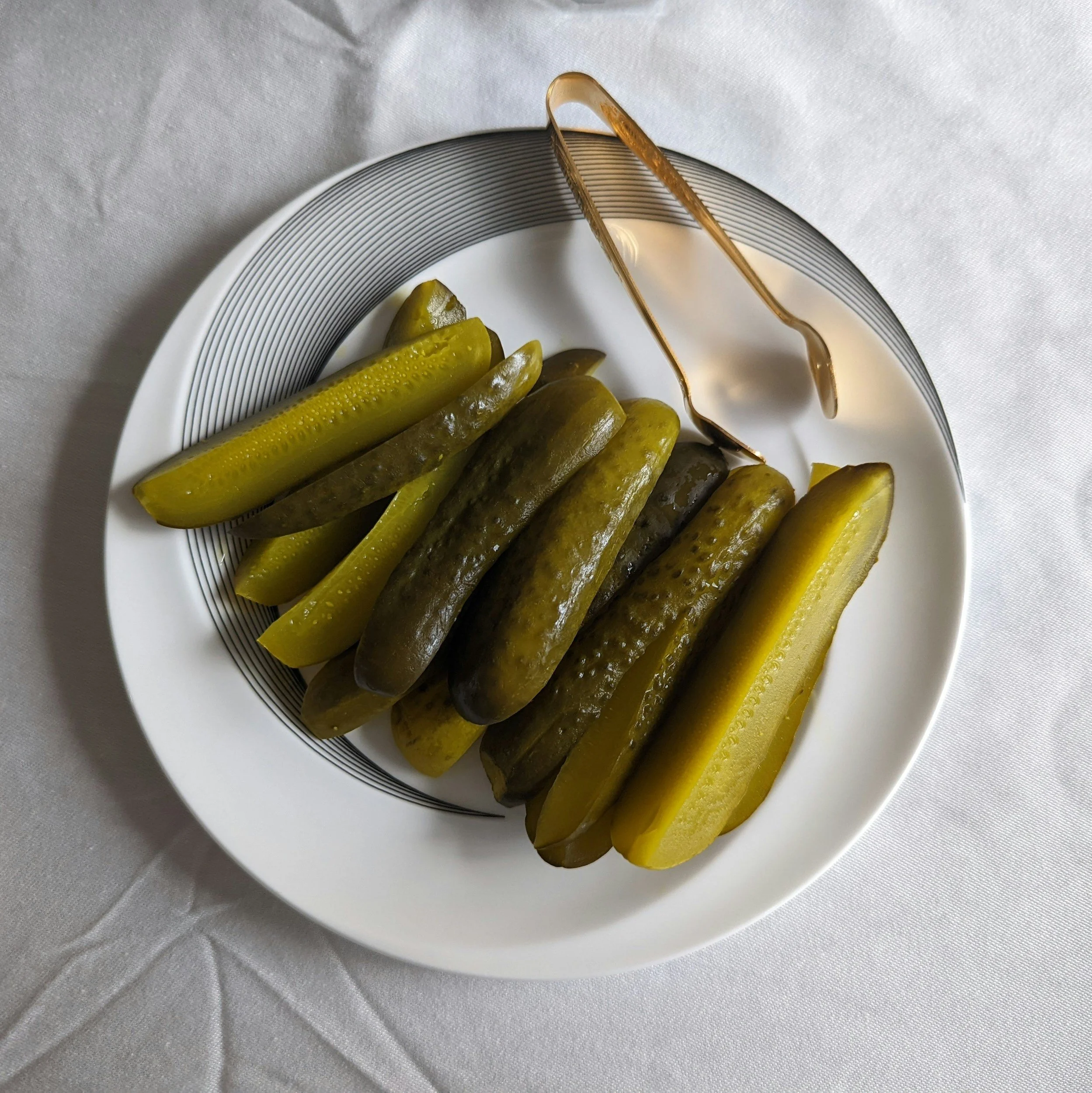 Sliced pickles on a plate