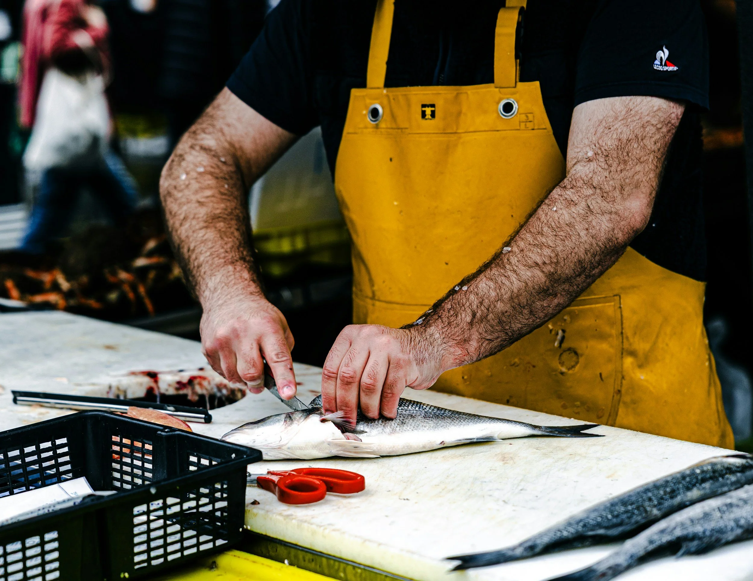 A man preparing fish for cooking