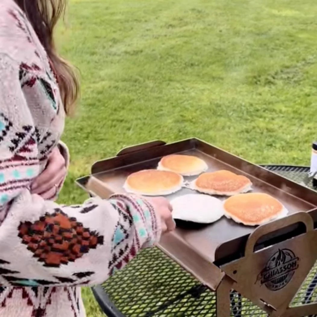 Making pancakes on an outdoor griddle for the Hauler Grill