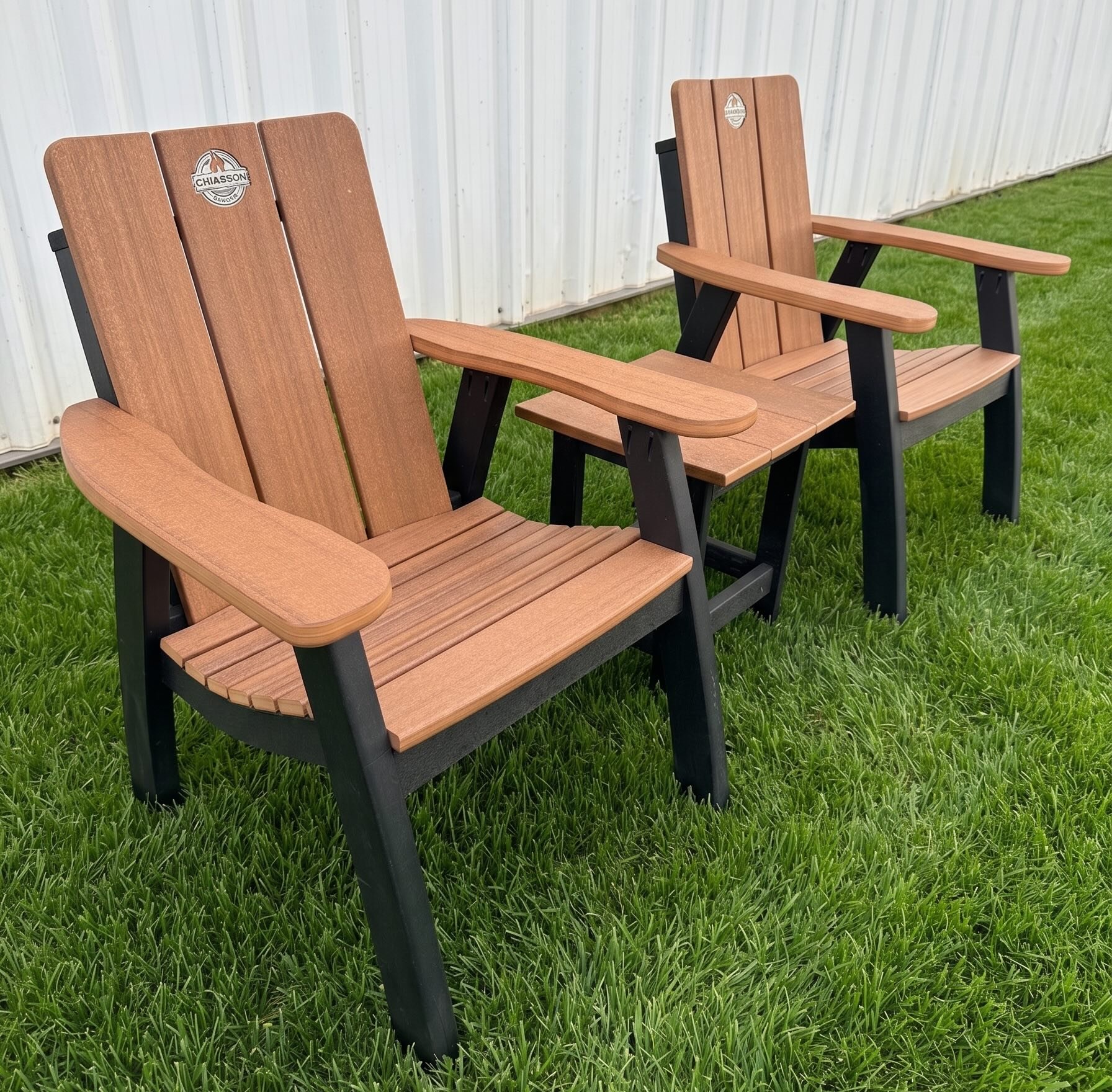 A pair of Chiasson Smoke Adirondack chairs on the lawn