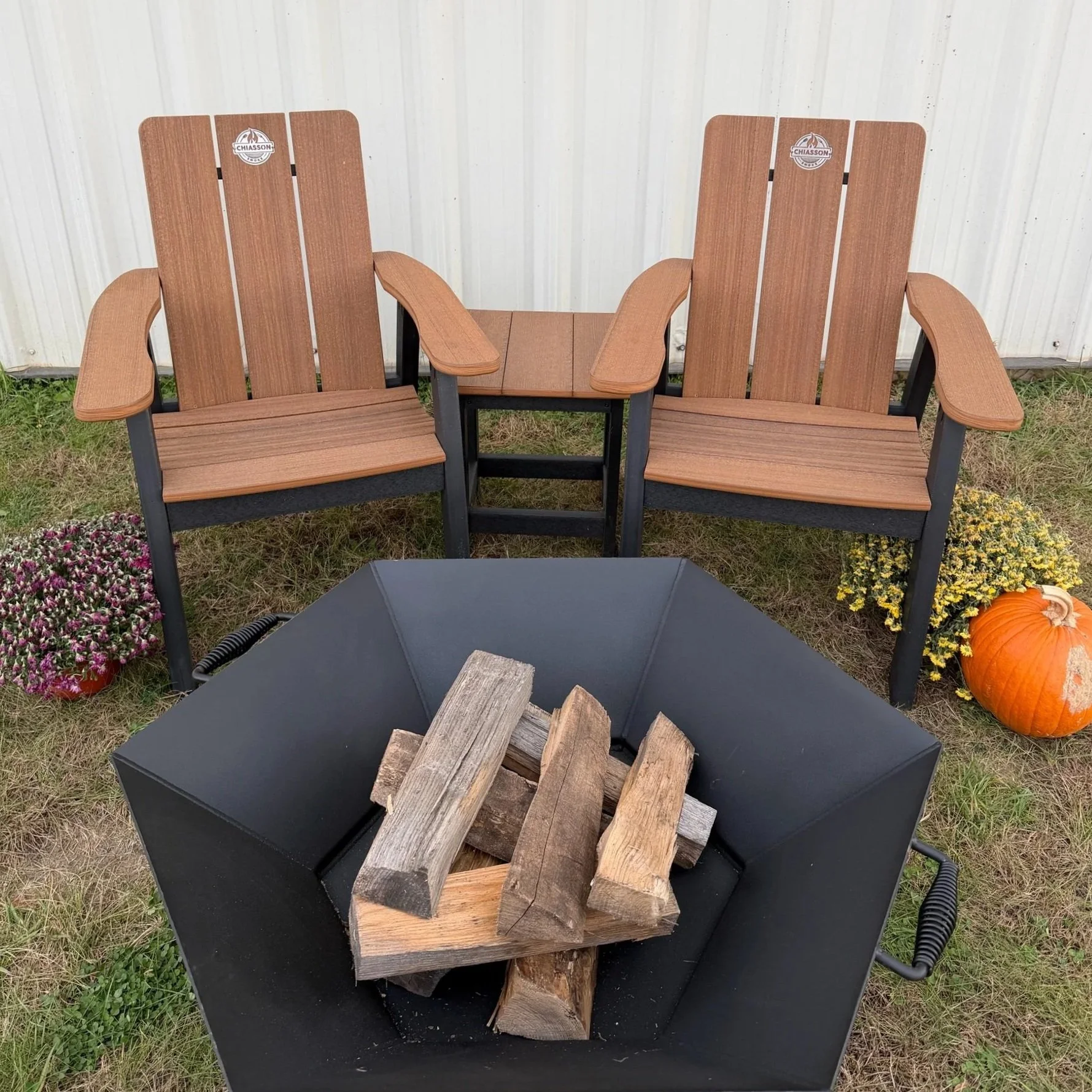 Chiasson Smoke Adirondack chairs set around a fire pit