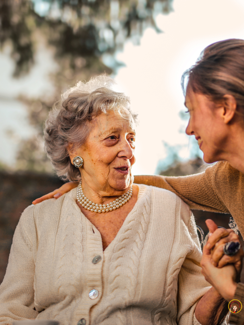 Adult daughter with elderly mom discussing Medicaid planning and long-term care options in North Carolina.