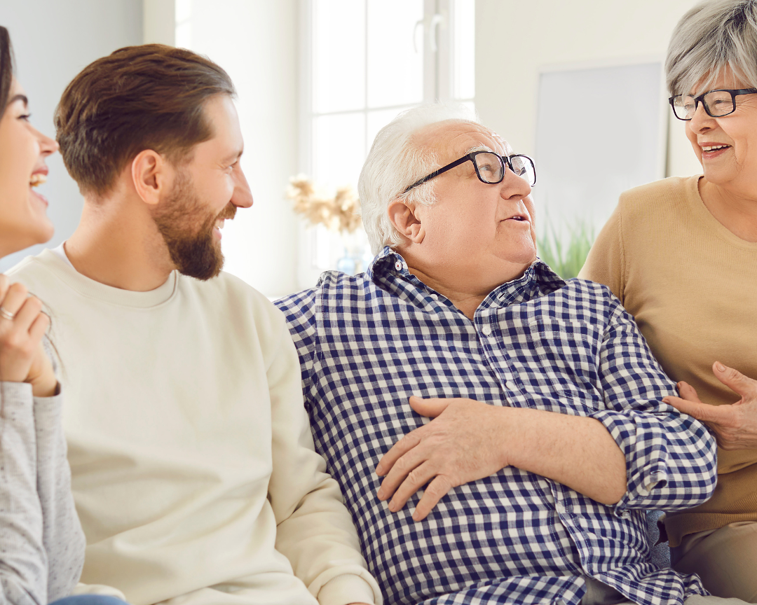 Adult children discussing power of attorney and estate planning decisions with aging parent.