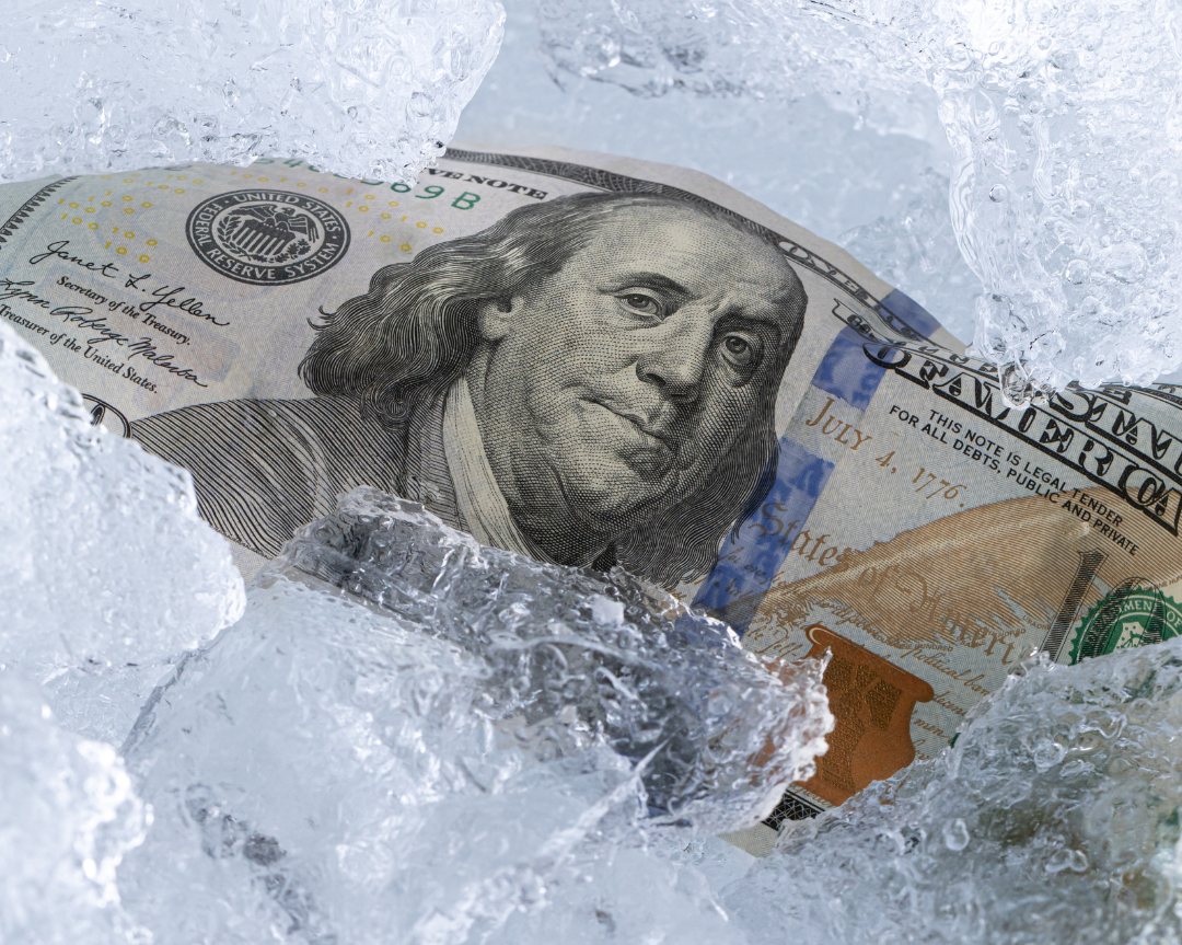 Money frozen in ice symbolizing restricted access to assets during probate in North Carolina