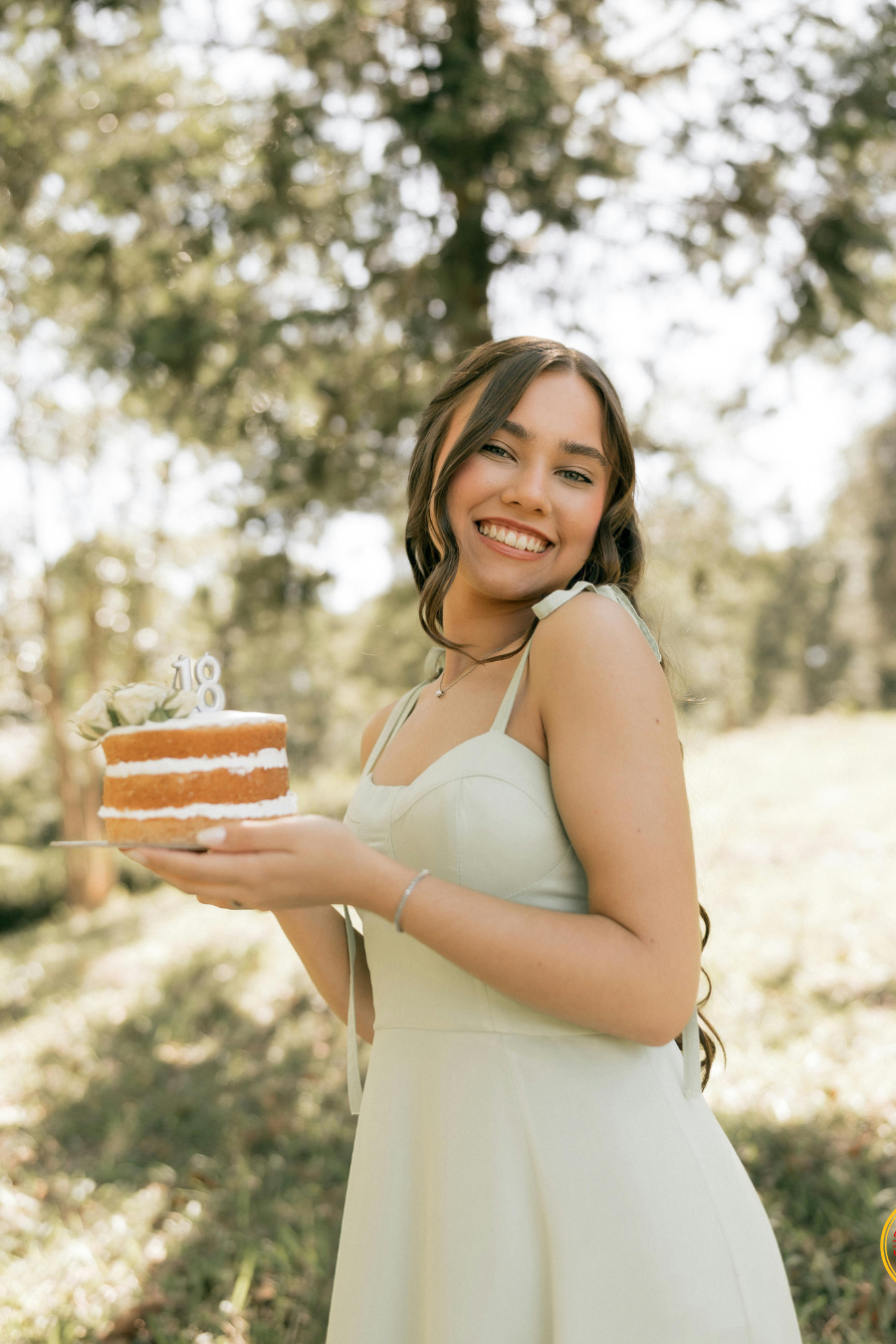 Young woman celebrating her 18th birthday, the age when North Carolina parents should discuss powers of attorney and other legal documents with their adult child.
