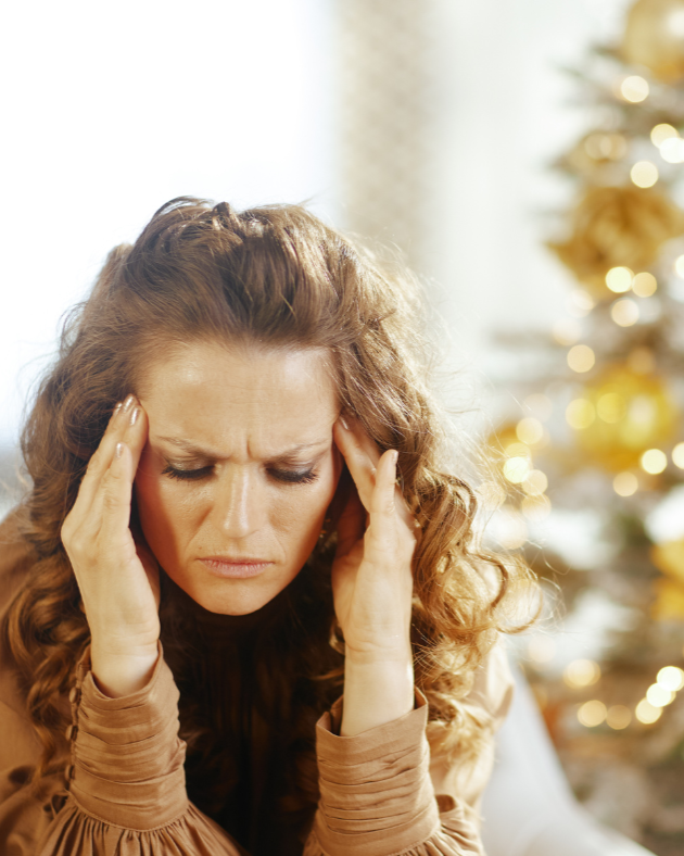 Woman feeling overwhelmed during the holidays, representing the stress families in Garner, North Carolina often experience when probate issues arise after a loved one passes.