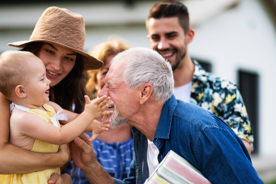 A multigenerational family in North Carolina sharing a joyful moment, highlighting the importance of protecting loved ones through estate planning and guardianship planning.