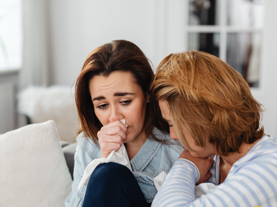Adult daughter and mother grieving together, illustrating how probate delays can emotionally impact families in Wake County, North Carolina after a loss.