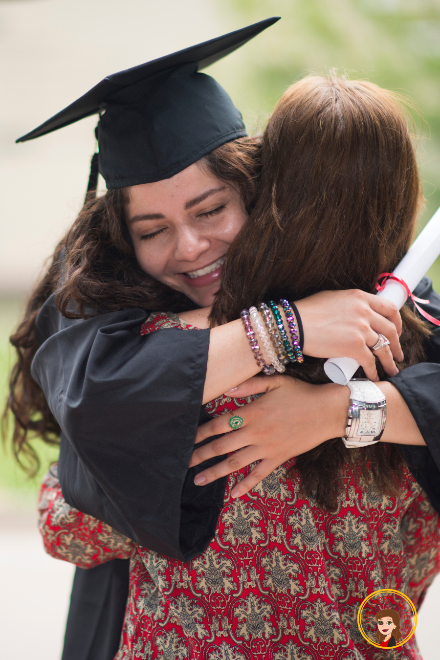 Young graduate embracing her mother, representing how inheritance planning can support a child's education and future opportunities.