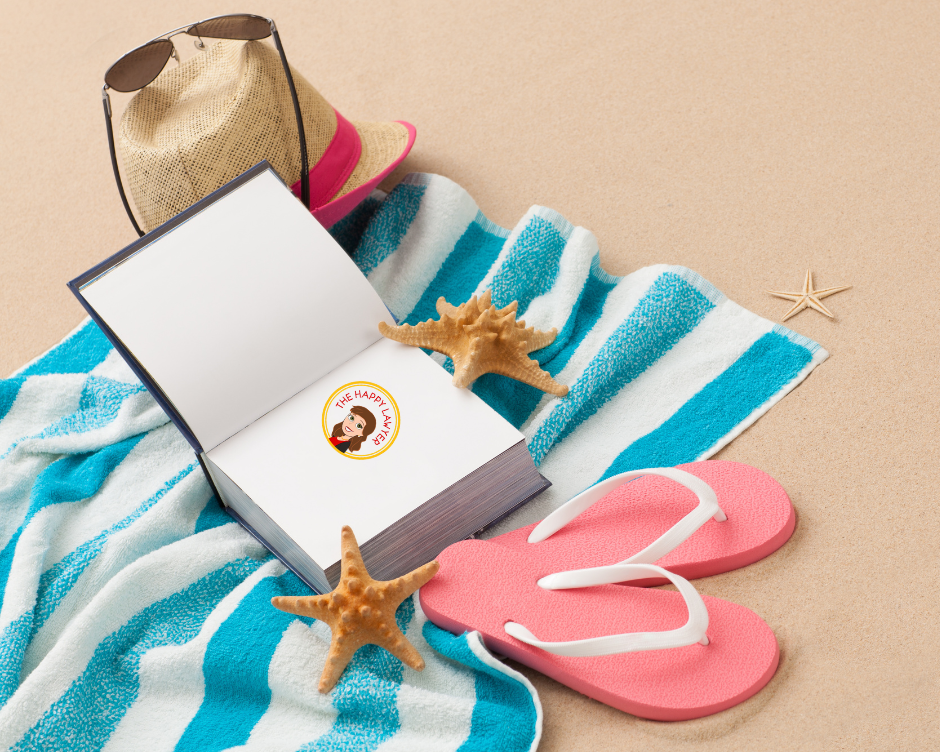 Beach towel with flip-flops, sunglasses, and an estate planning book representing the importance of reviewing estate planning documents before summer travel in North Carolina.