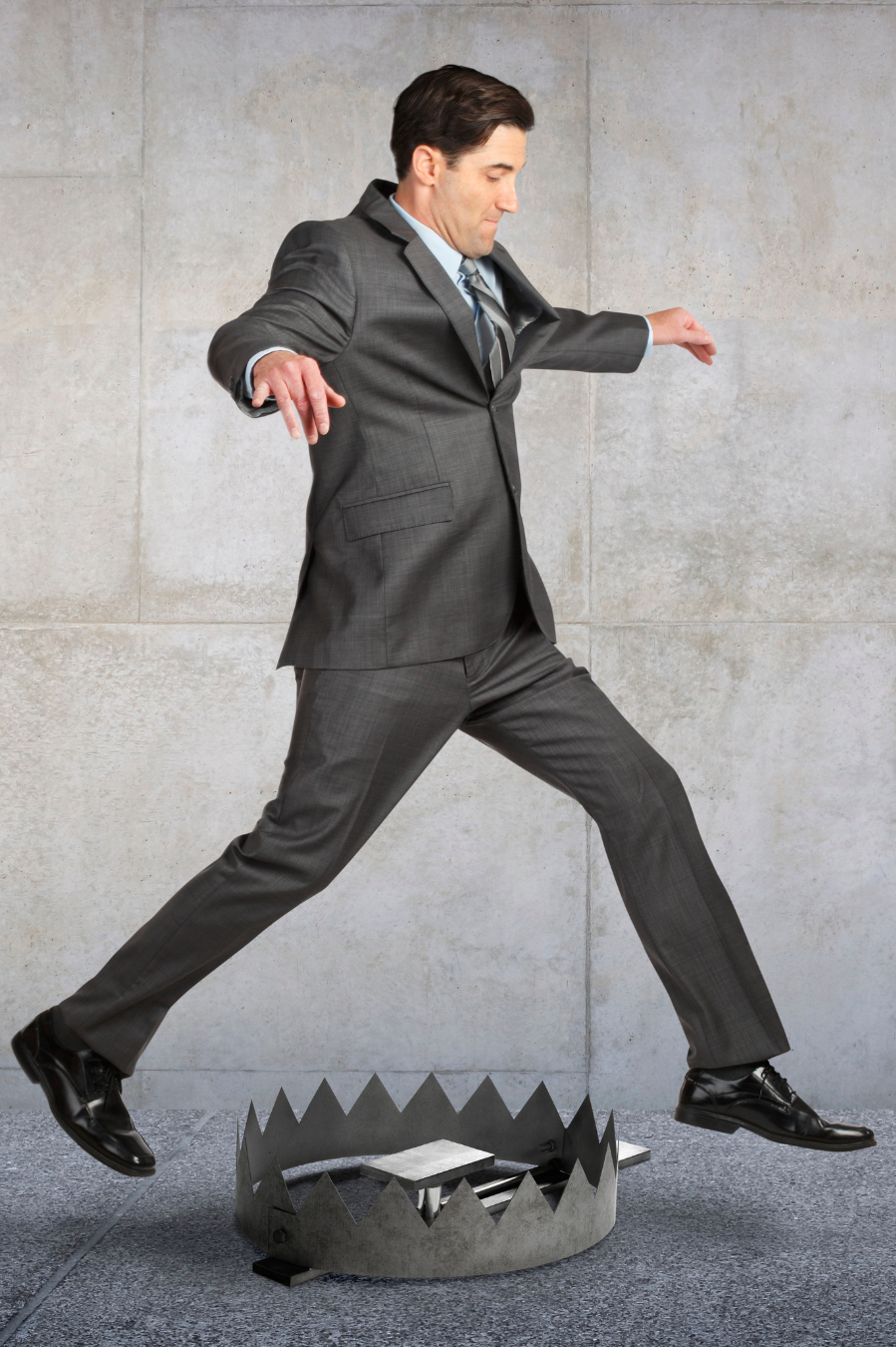 Man stepping over a trap representing hidden probate risks in North Carolina estate planning