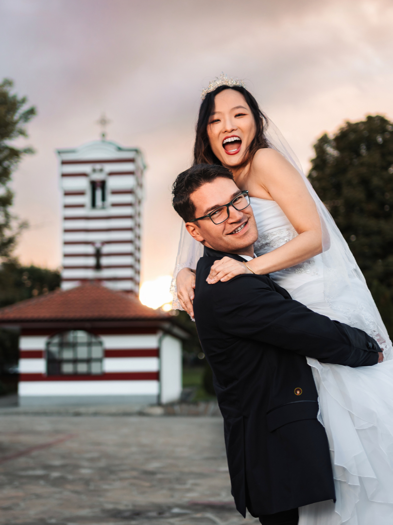 Smiling bride and groom celebrating their wedding day, representing married couples in North Carolina who need estate planning protection.