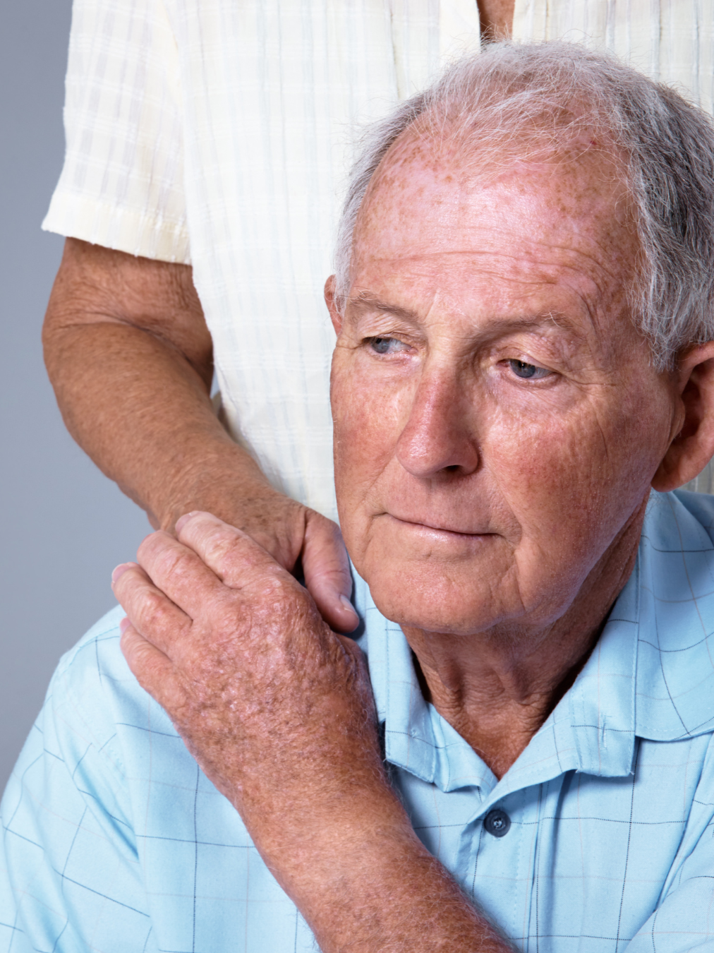 A surviving spouse receiving comfort from a family member after the loss of a loved one in North Carolina.