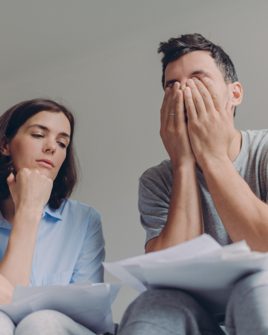 Couple feeling overwhelmed by probate paperwork after being named executor in North Carolina, common for families in Garner and Wake County.