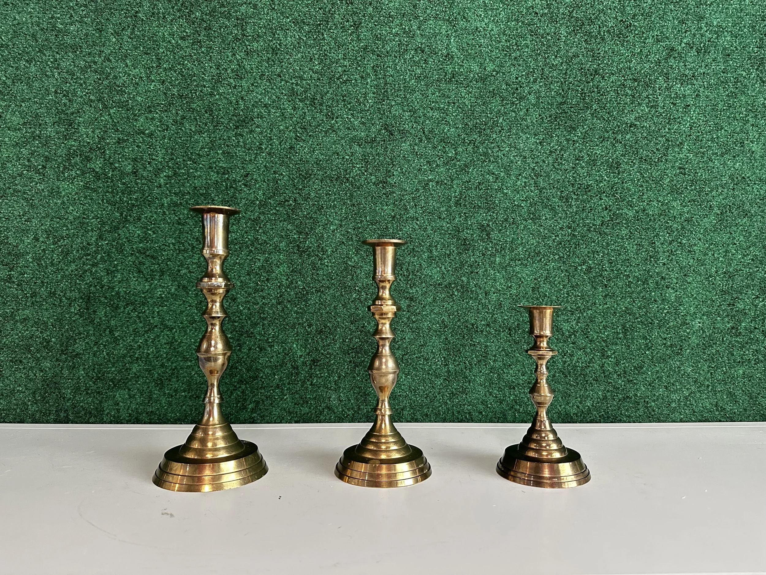 Vintage brass taper candle holder set rental for weddings and events in Tri-Cities WA with romantic gold décor and floral styling.