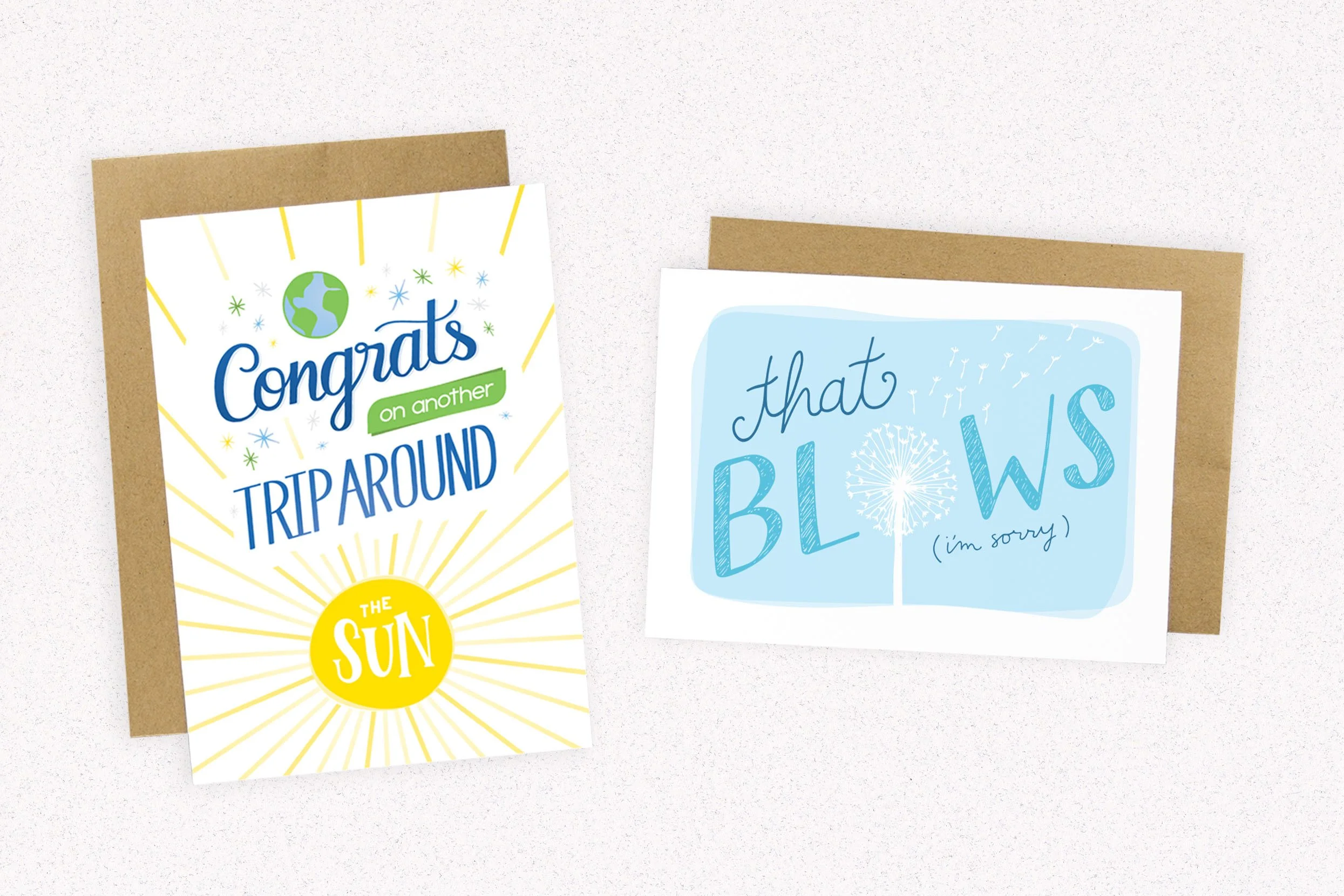 Hand lettered and illustrated greeting card designs, Congrats on another trip around the sun birthday and that blows im sorry cards