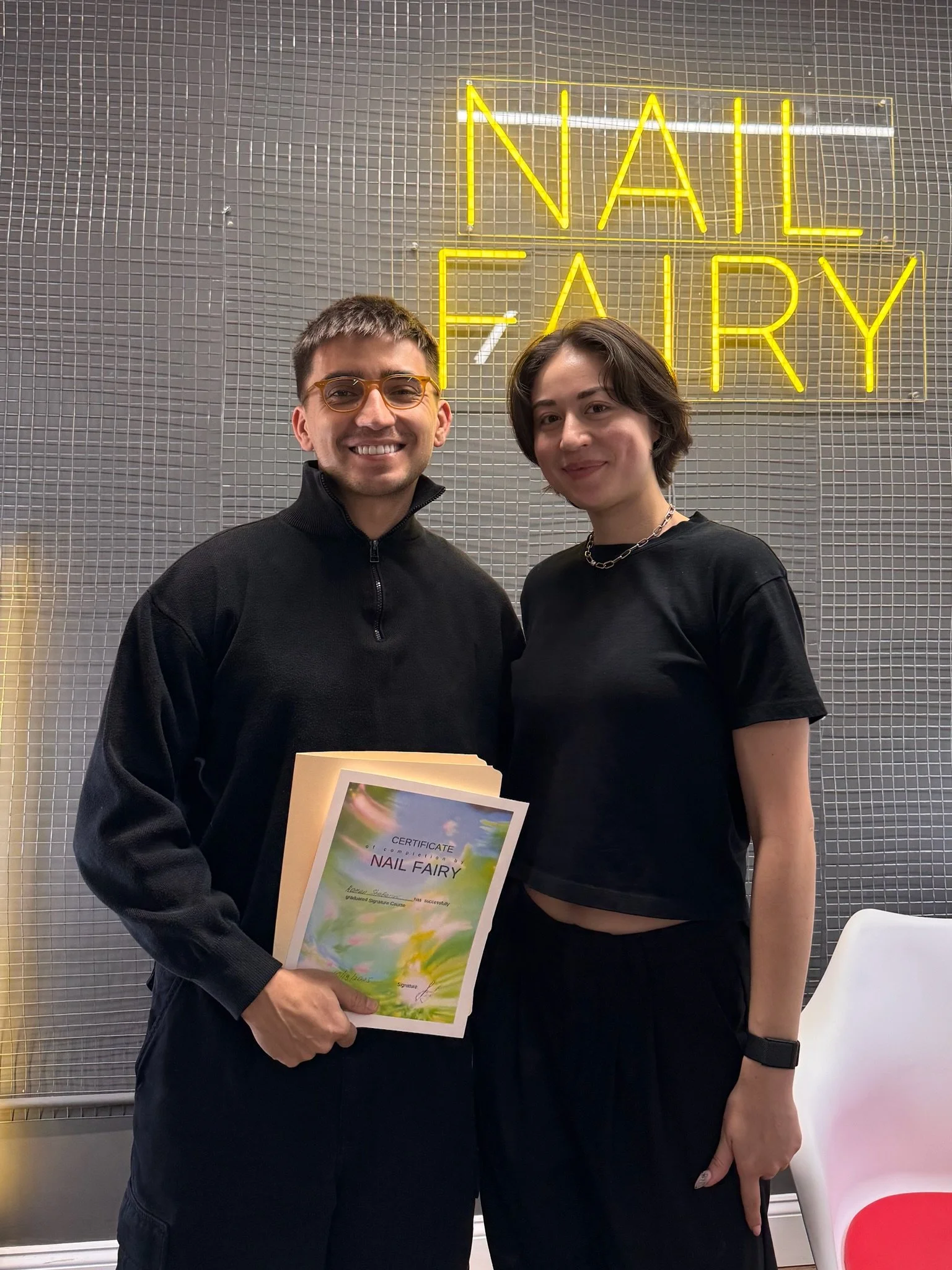 Students learning clean e-file cuticle prep during Nail Fairy Academy class