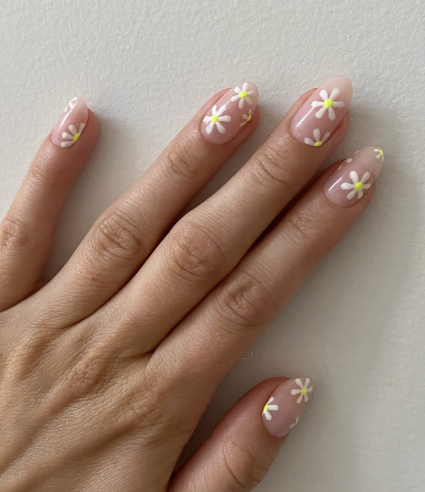 Floral nail art design for spring with soft colors in NYC nail salon