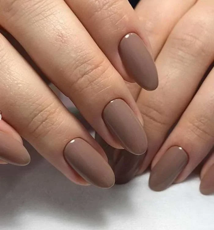 Fall gel nails at Nail Fairy NYC — deep burgundy, rust and terracotta seasonal manicure