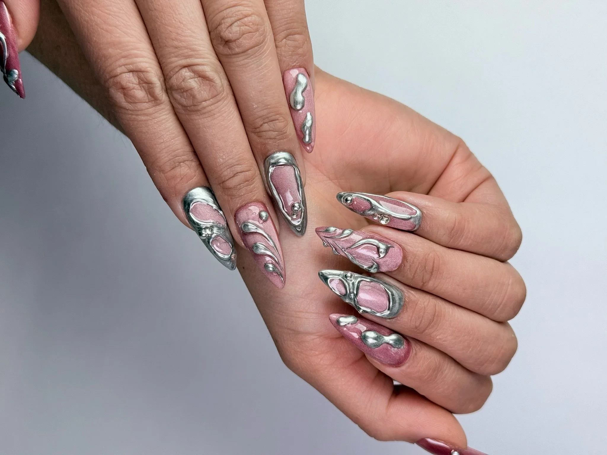 Chrome glass nails with reflective finish on structured gel manicure in NYC