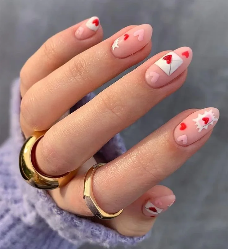 Valentine's nail art at Nail Fairy NYC — hearts, red and pink gel manicure designs