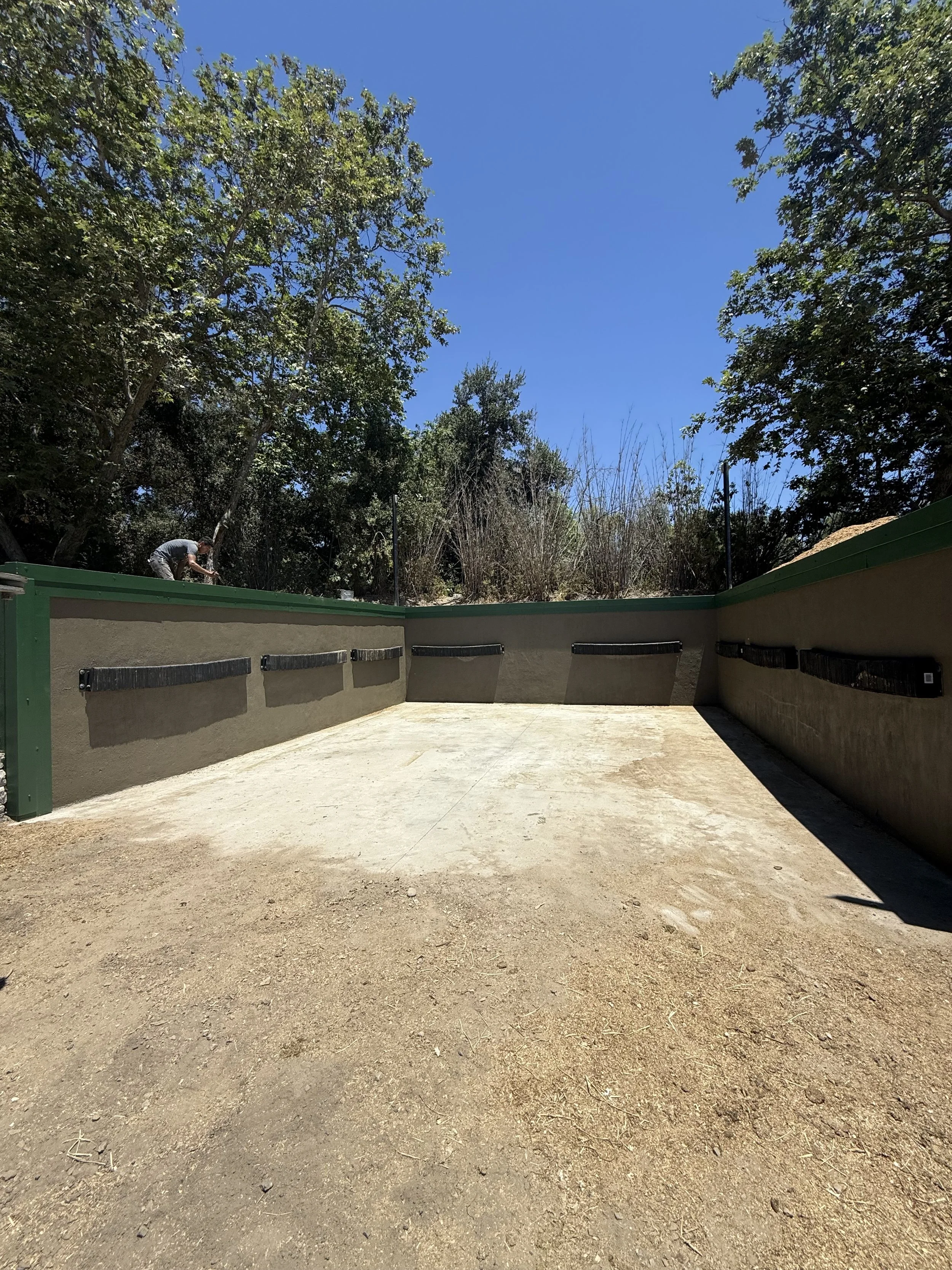 Large 10ft tall retaining wall manure containment for equestrian center  