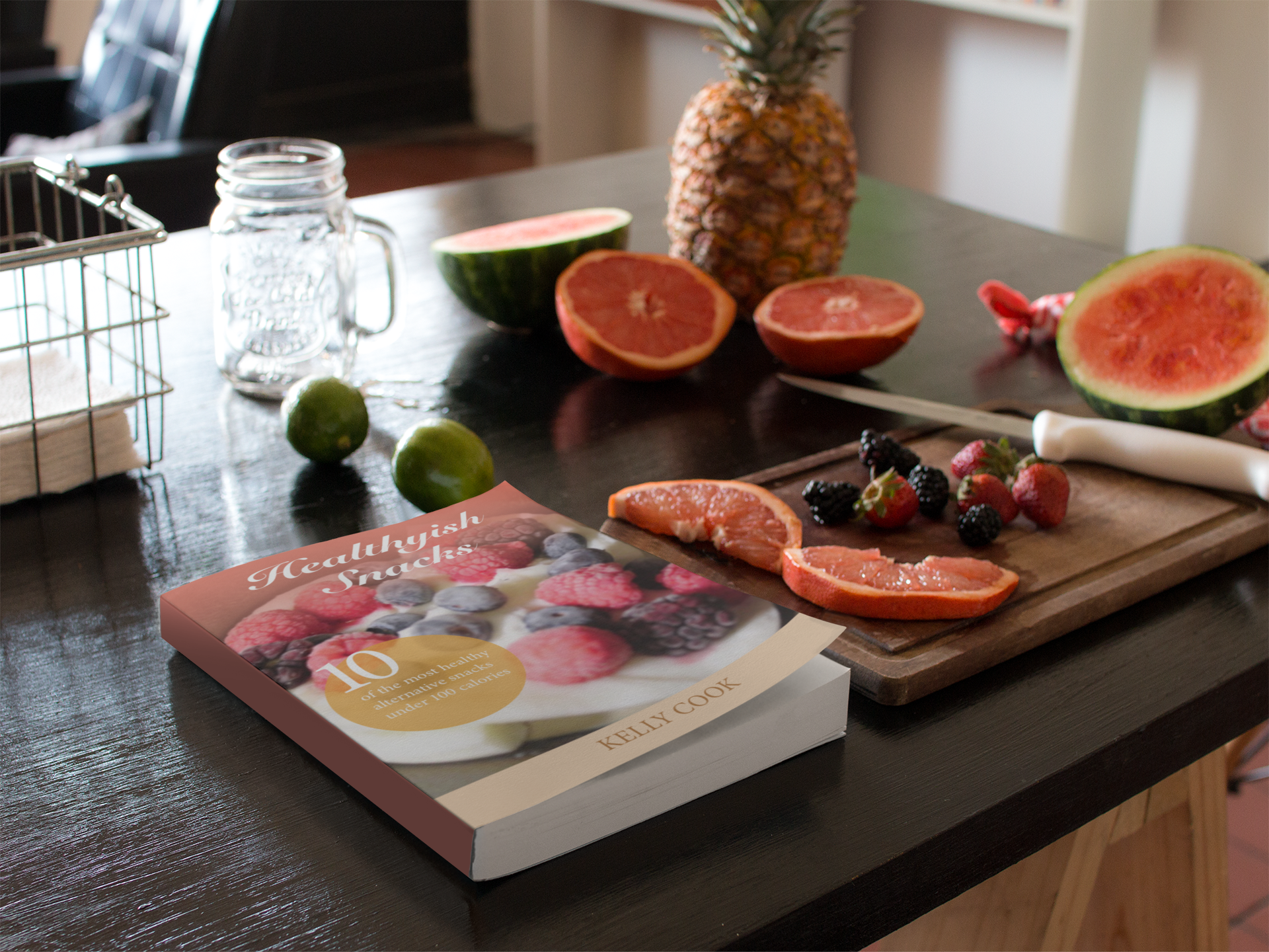 book-lying-on-a-kitchen-table-next-to-fruits-and-knife-mockup-a14439.png