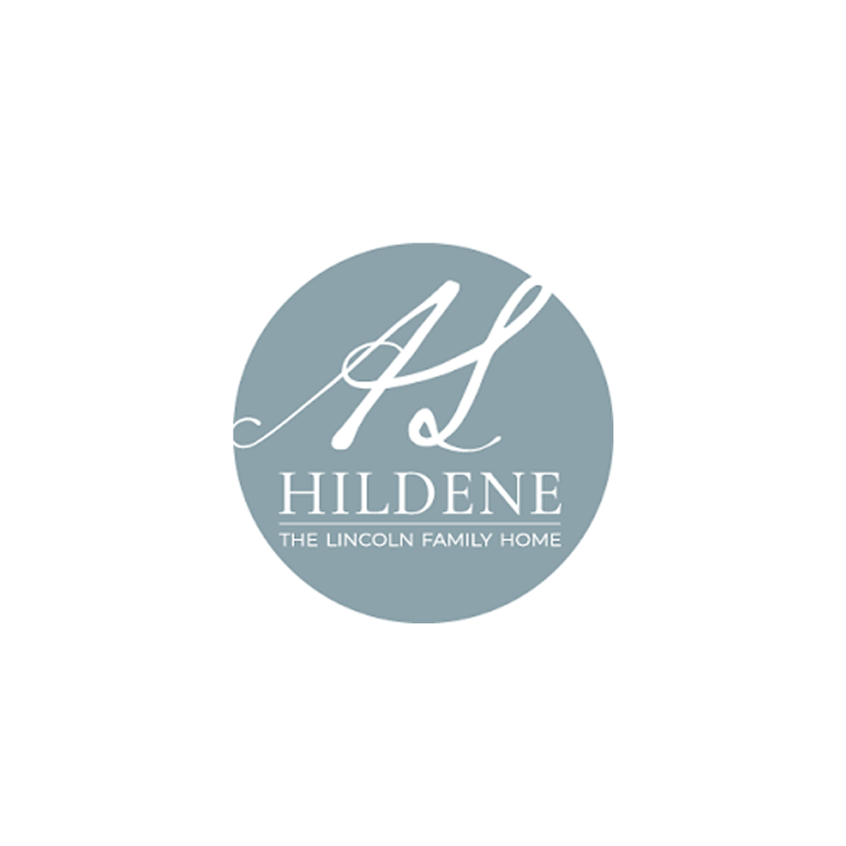 Logo with a grey circle background, featuring a stylized white monogram of the letters 'H' and 'L', and text that reads 'HILDENE THE LINCOLN FAMILY HOME'.