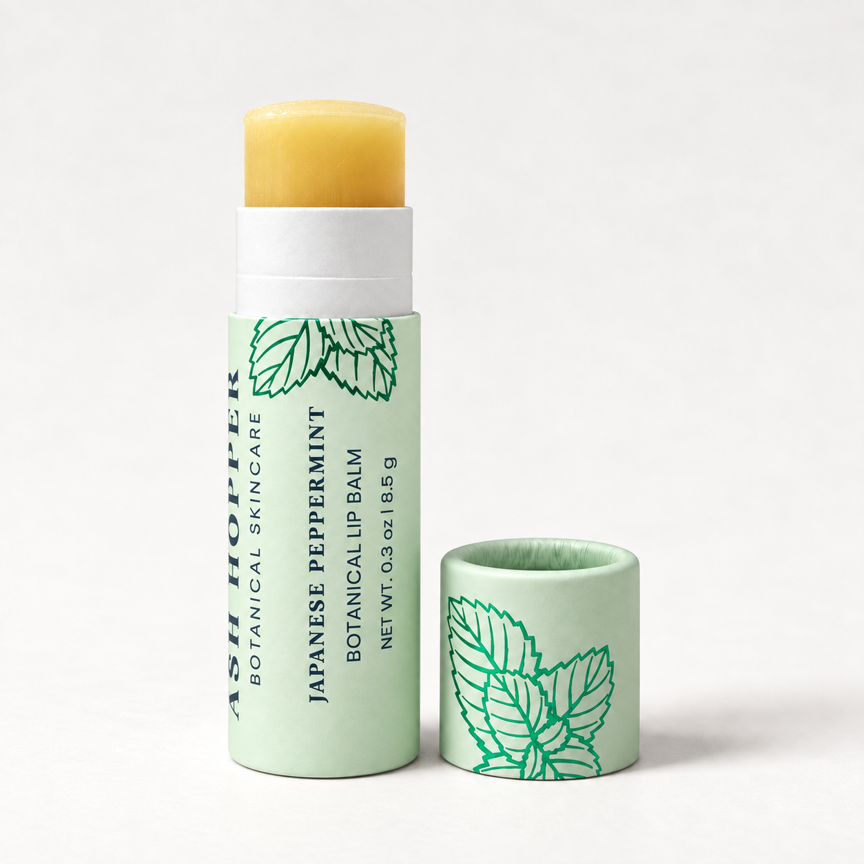 Open golden balm tube with cap.png