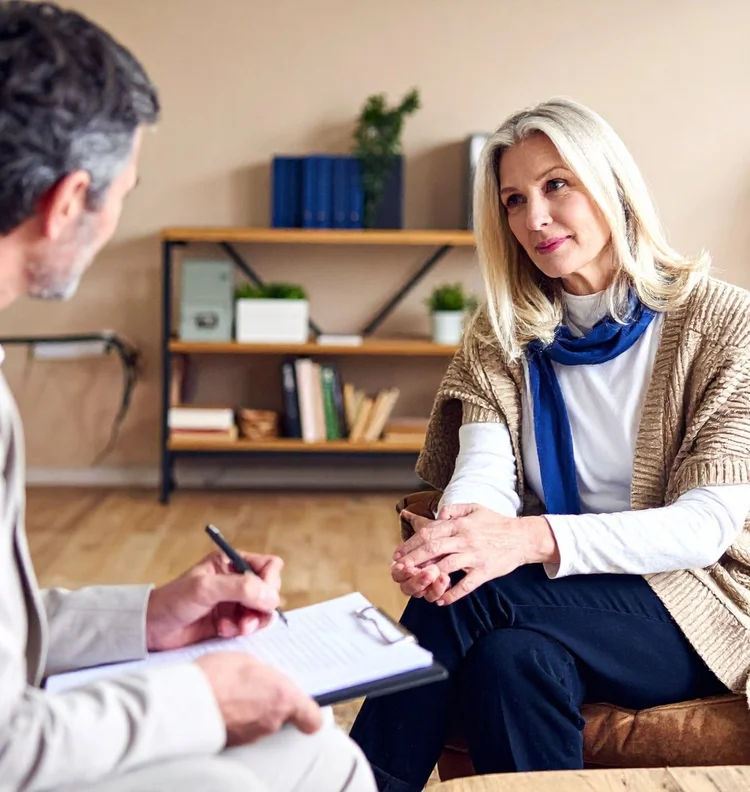 A woman working through a phobia with her hypnotherapist