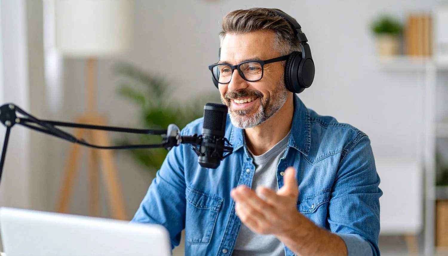 A confident man speaking with a microphone