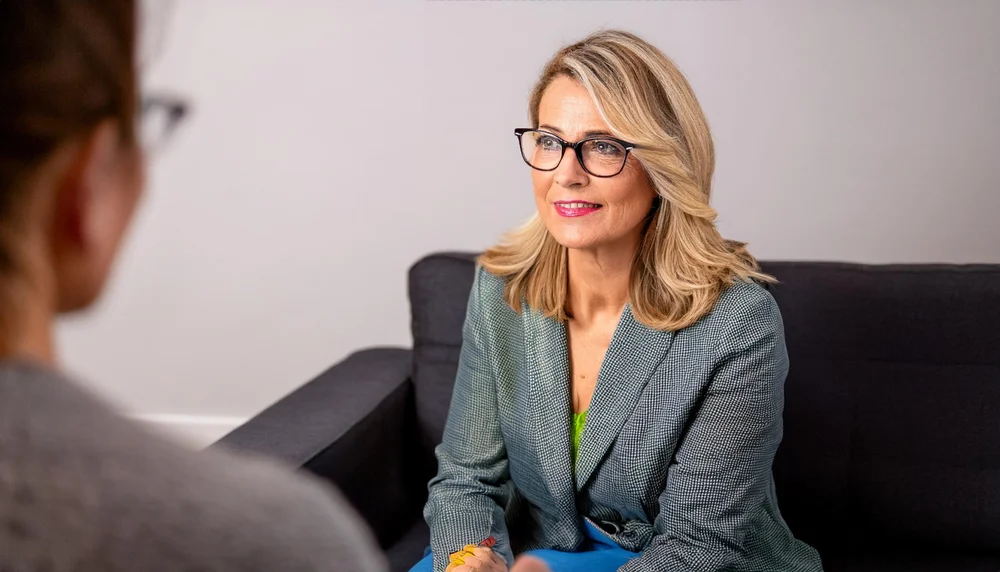 A woman in a calm CBT therapy session