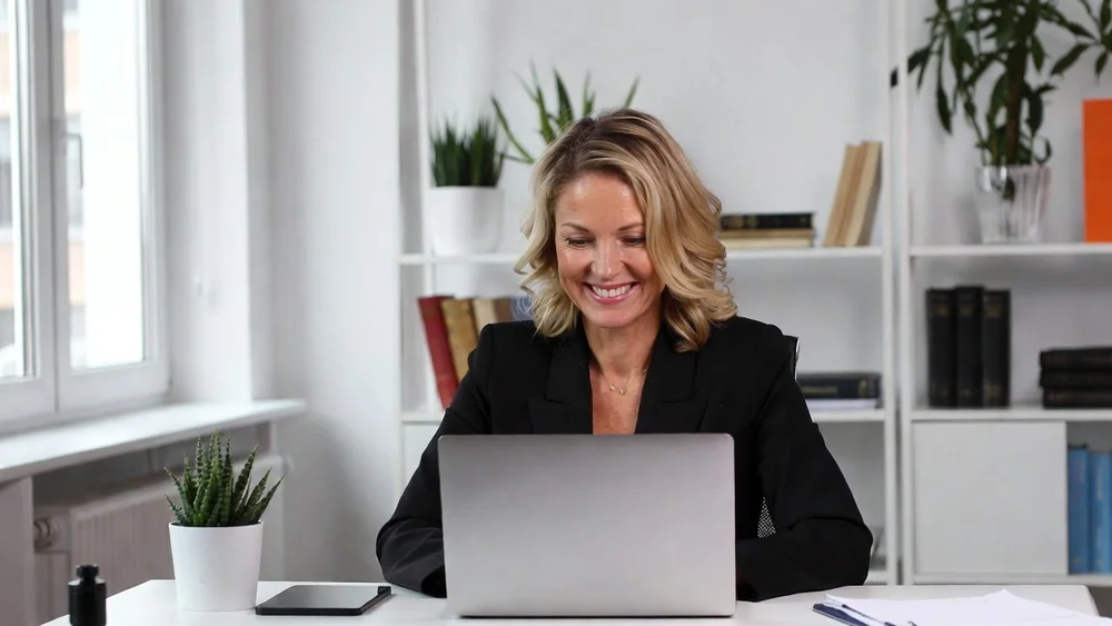 A member of staff having a confidential online therapy session with an OLIP Therapy therapist by video call