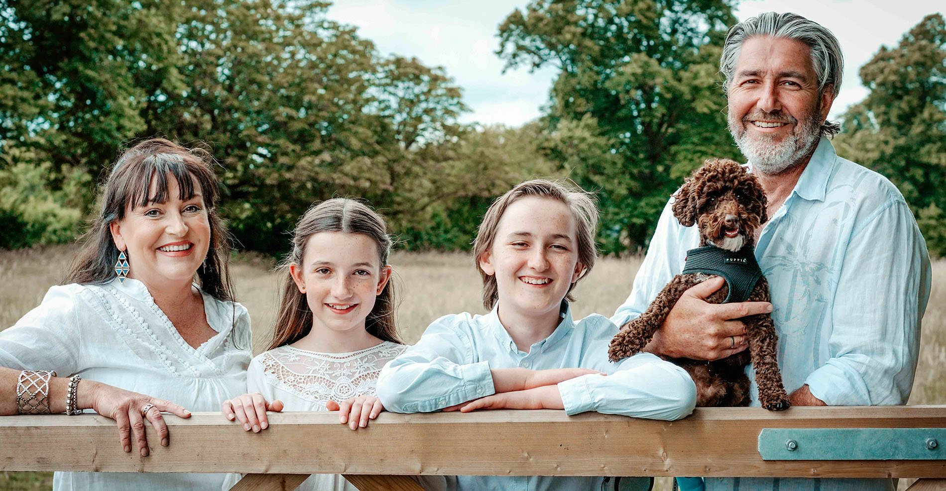 family-with-dog-at-blenheim-palace-stood-by-cattle-gate-in-oxfordshire-during-candid-relaxed-family-shoot-with-photographer-david-lefebvre-from-buckinghamshire.jpg