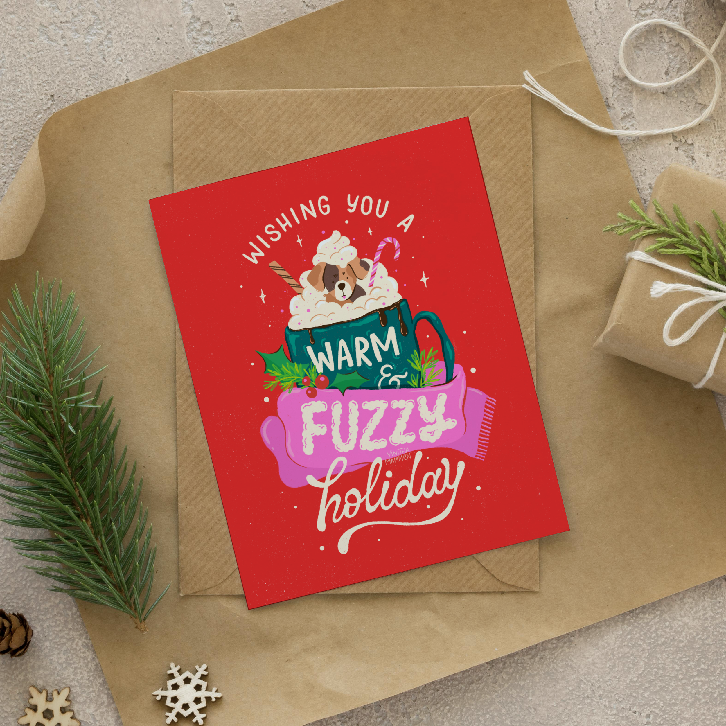 greeting card design with illustrated lettering featuring a puppy in a mug of hot chocolate, holiday illustrations and lettering wishing you a warm and fuzzy holiday