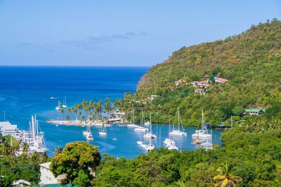 Yachts are anchored in the bay in St. Lucia