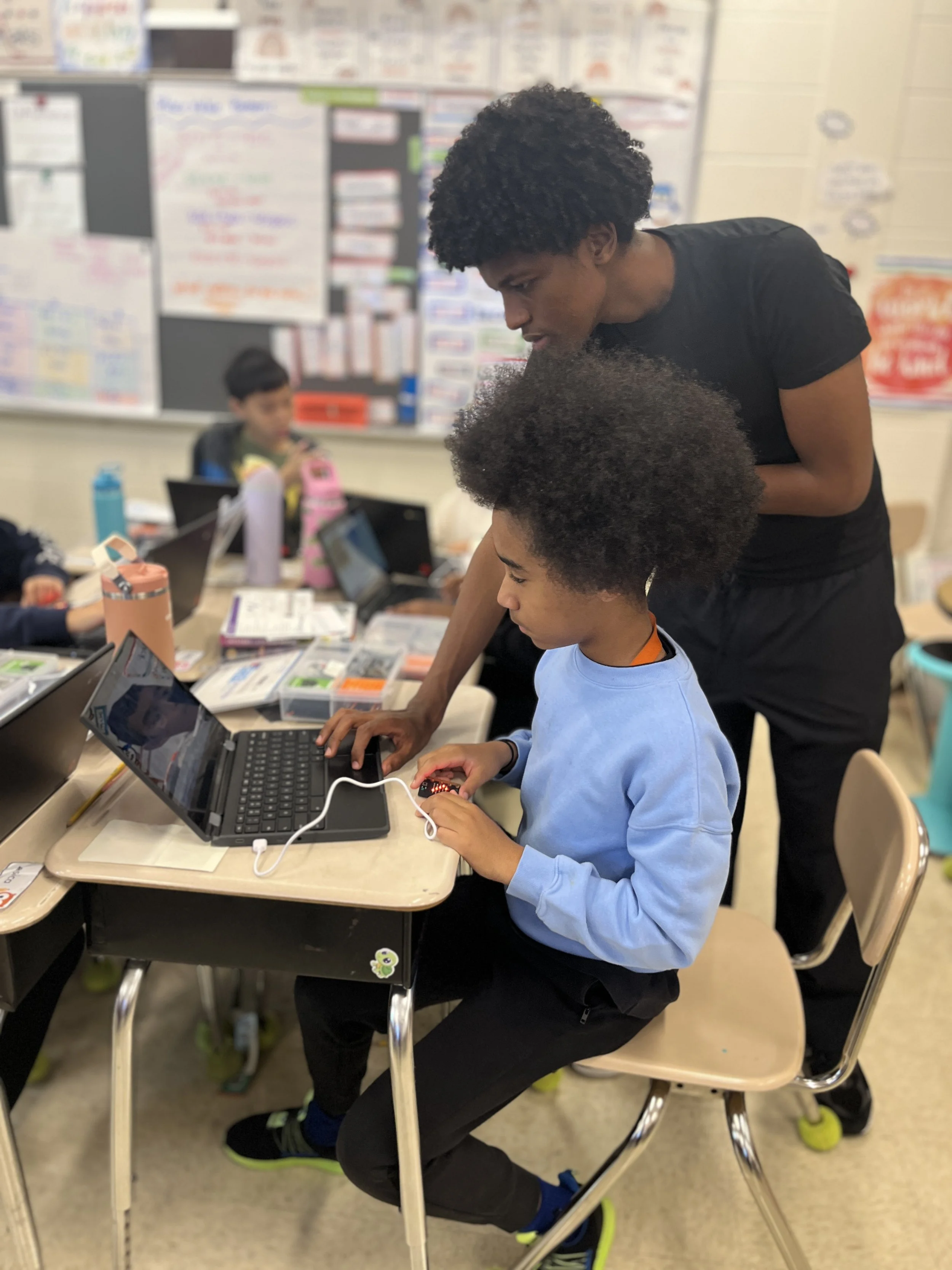 Teacher helping kid.jpg