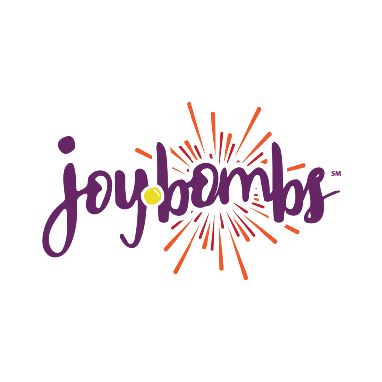Joy Bombs logo with purple text and a yellow dot, surrounded by orange fireworks.