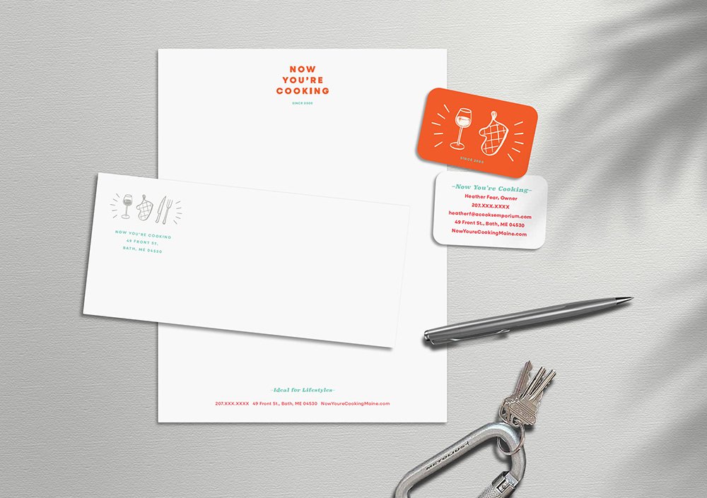 Finished brand stationery demonstrating real-world application of a cohesive visual identity system designed by Murphy Empire